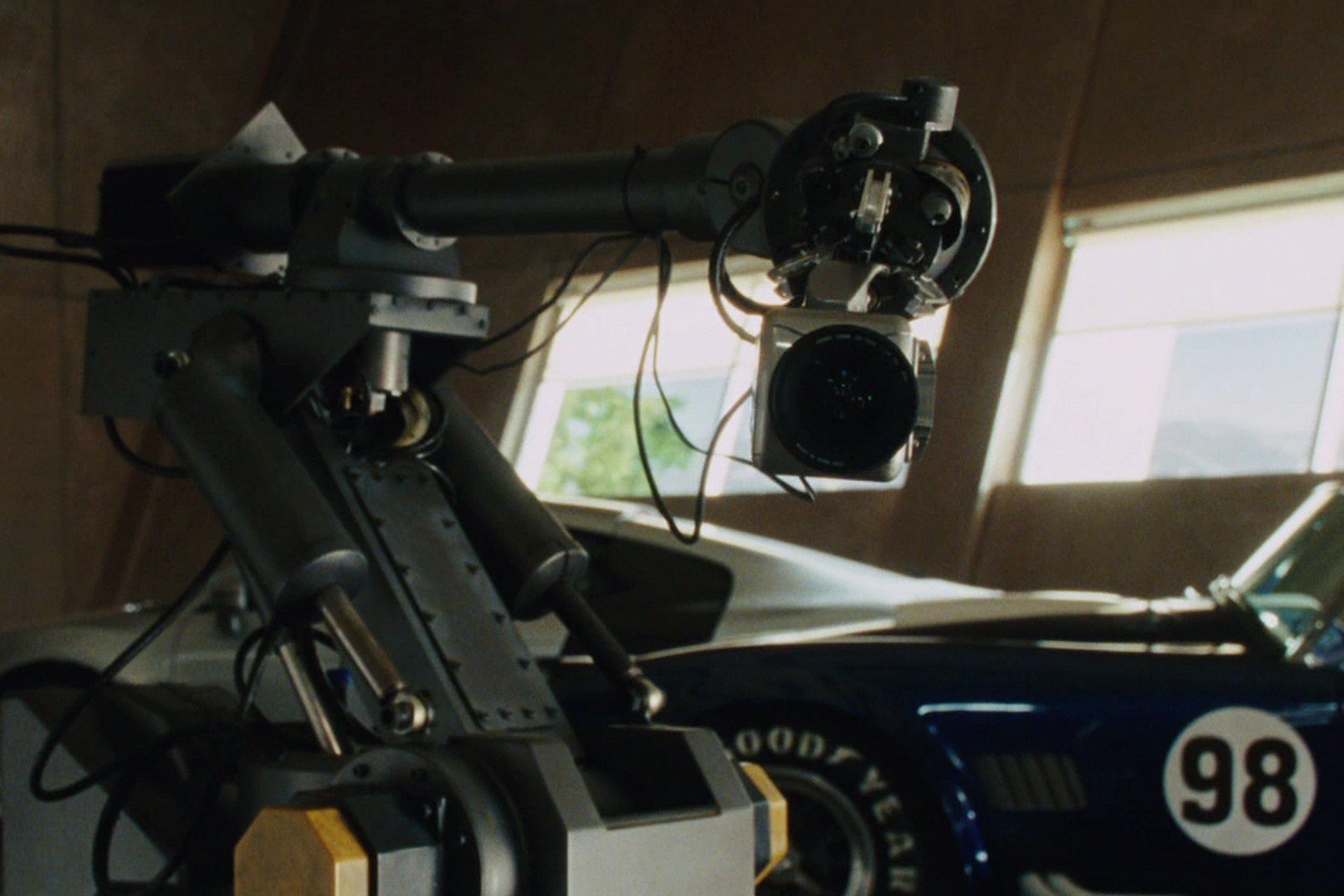 Chapter 22: An Unlikely Synthesis a still from the iron man and Tony's robot dum-e. A one arm factory style bot.