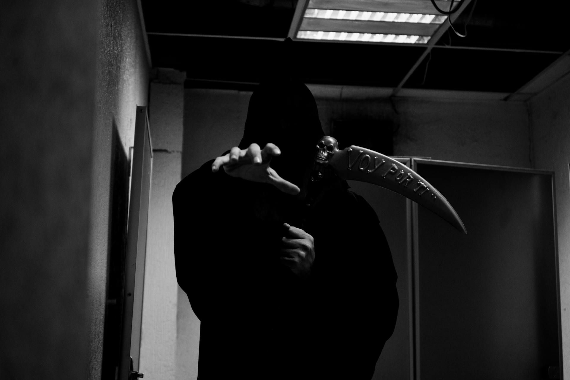 death becomes her an image of the grim reaper with his weapon reaching to the photographer