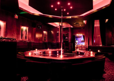 a stripper club with a pole.