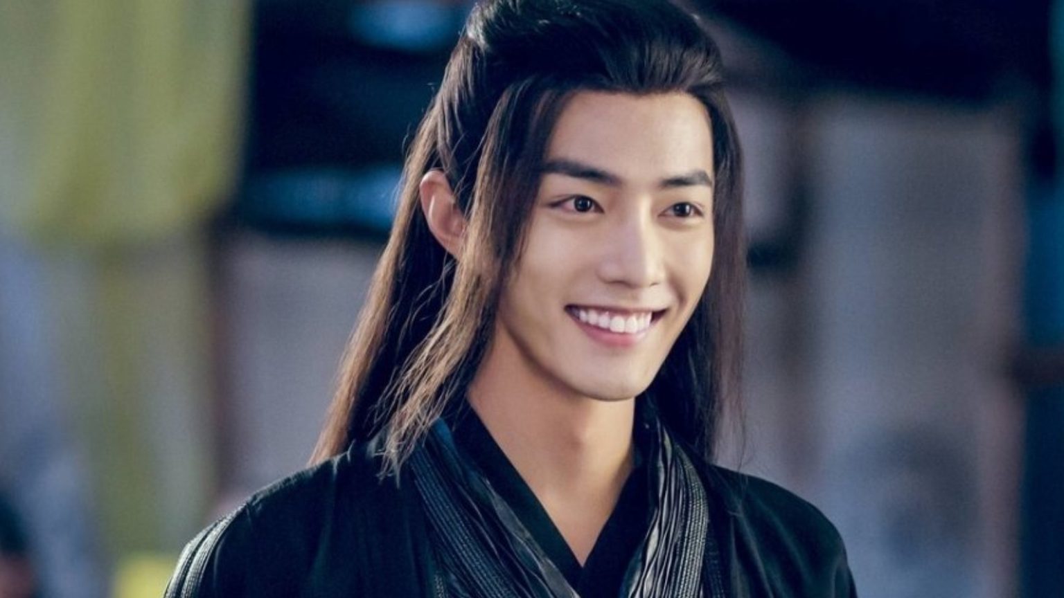 Wei Ying - a pretty Chinese man dressed in black and red robes