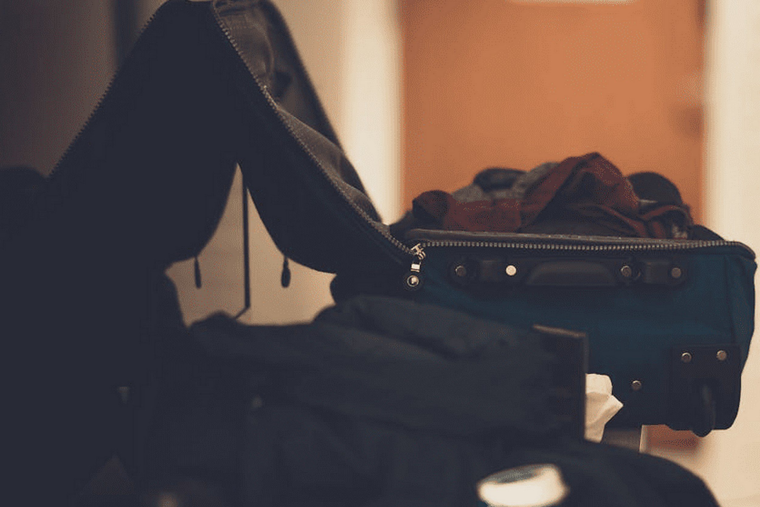 An image of open suitcases sitting on the floor. An image of open suitcases sitting on the floor.
