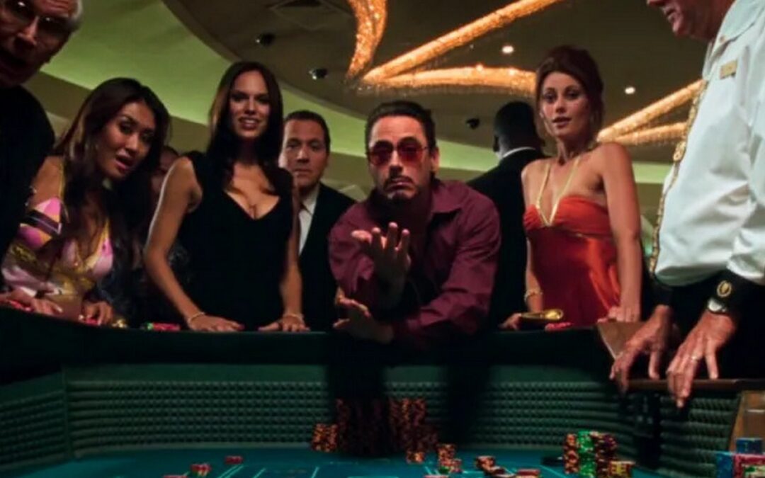 an image of Tony Stark (Robert Downey Jr) in Iron Man at a Vegas at gambling.