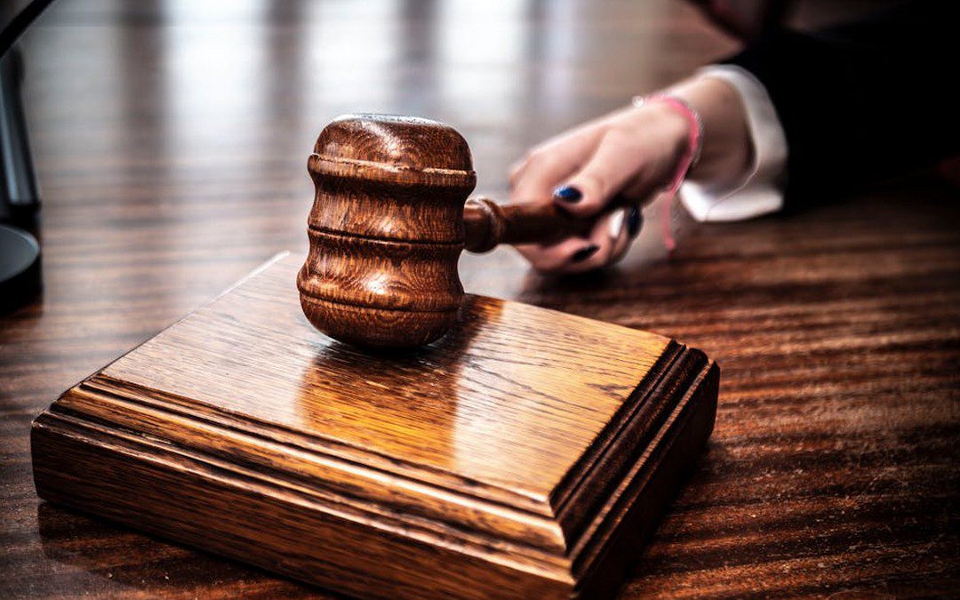 a judge holding a gavel.