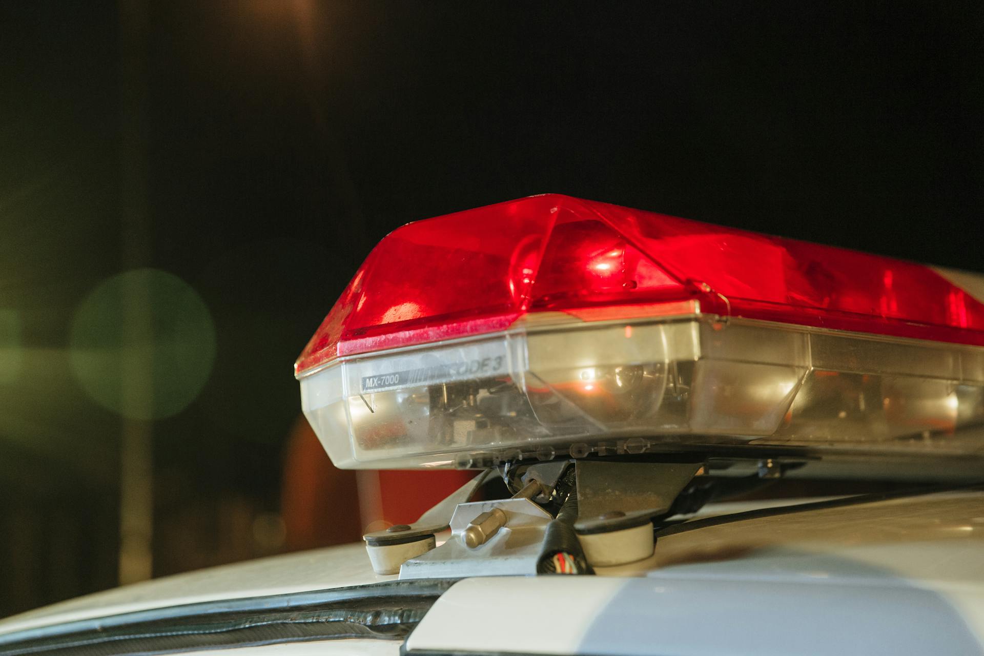 An image of a police siren on top of a cop car.